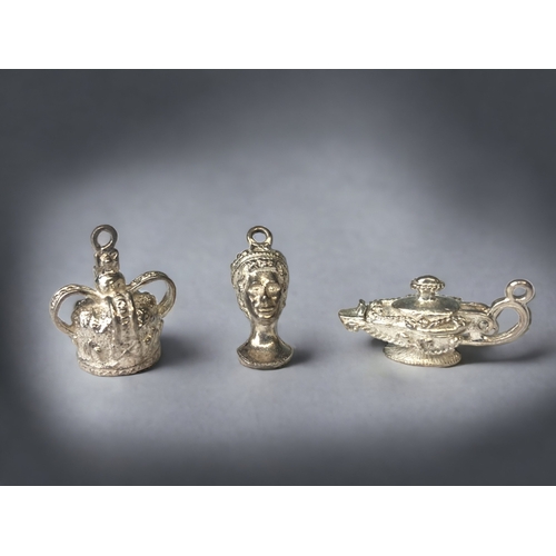 A COLLECTION OF VINTAGE SILVER CHARMS.