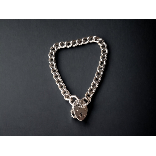 A STERLING SILVER CURB LINK HEART PADLOCK