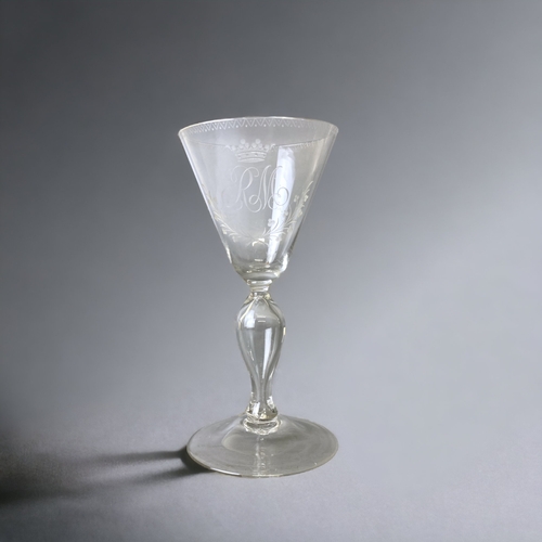 A 19TH CENTURY ENGRAVED WINE GLASS.