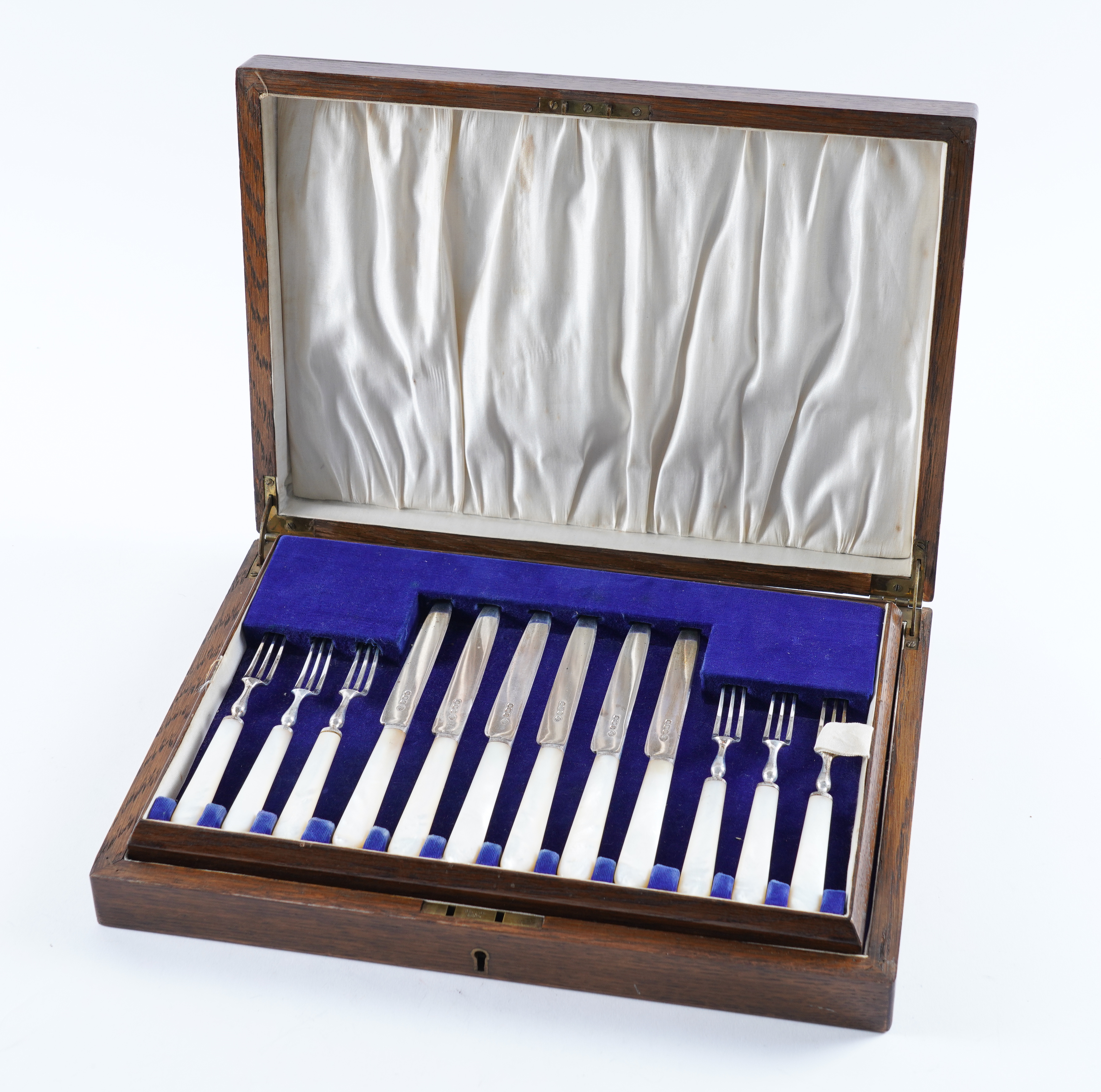 A SET OF TWELVE PAIRS OF SILVER