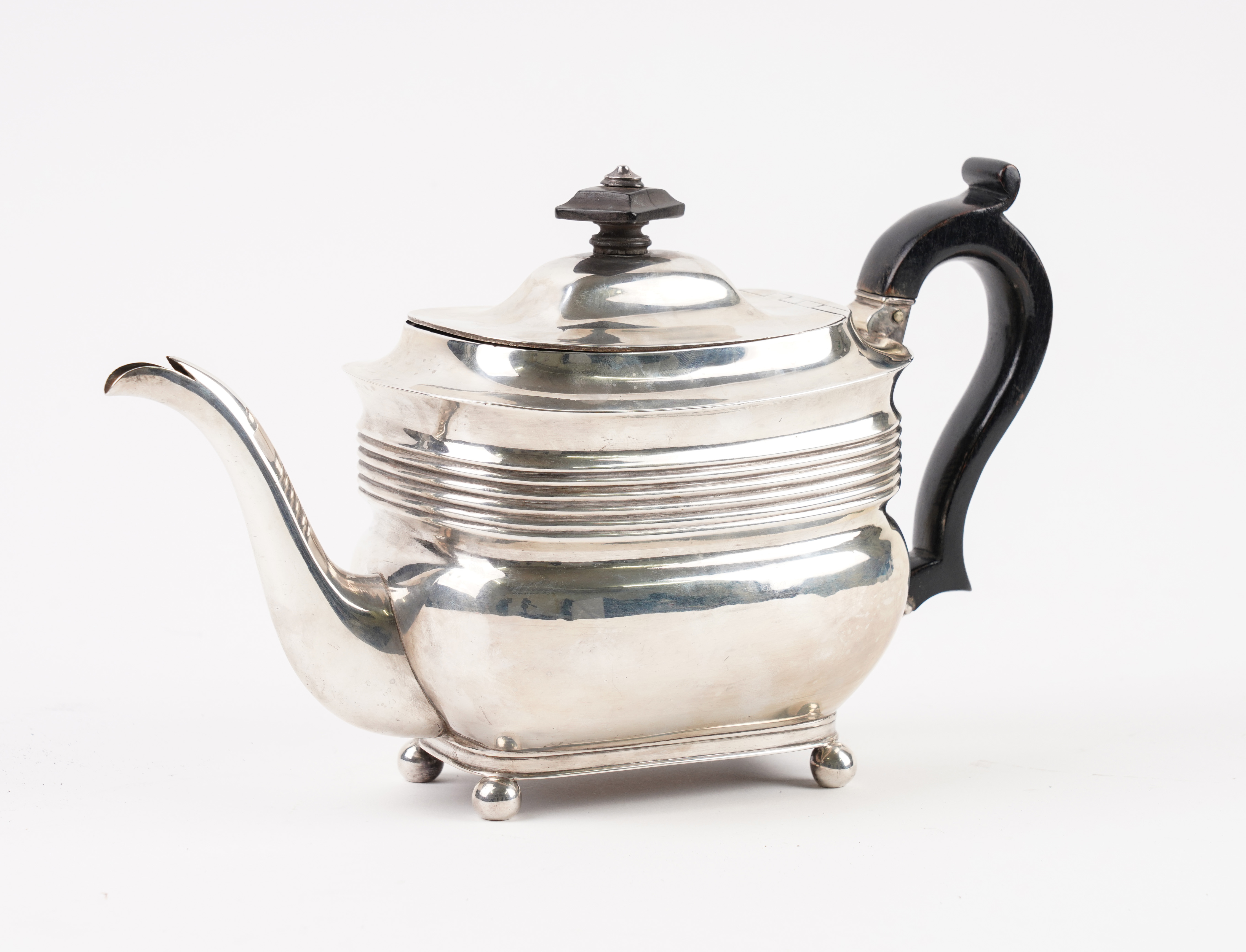 A GEORGE III SILVER TEAPOT Of curved 3ae648