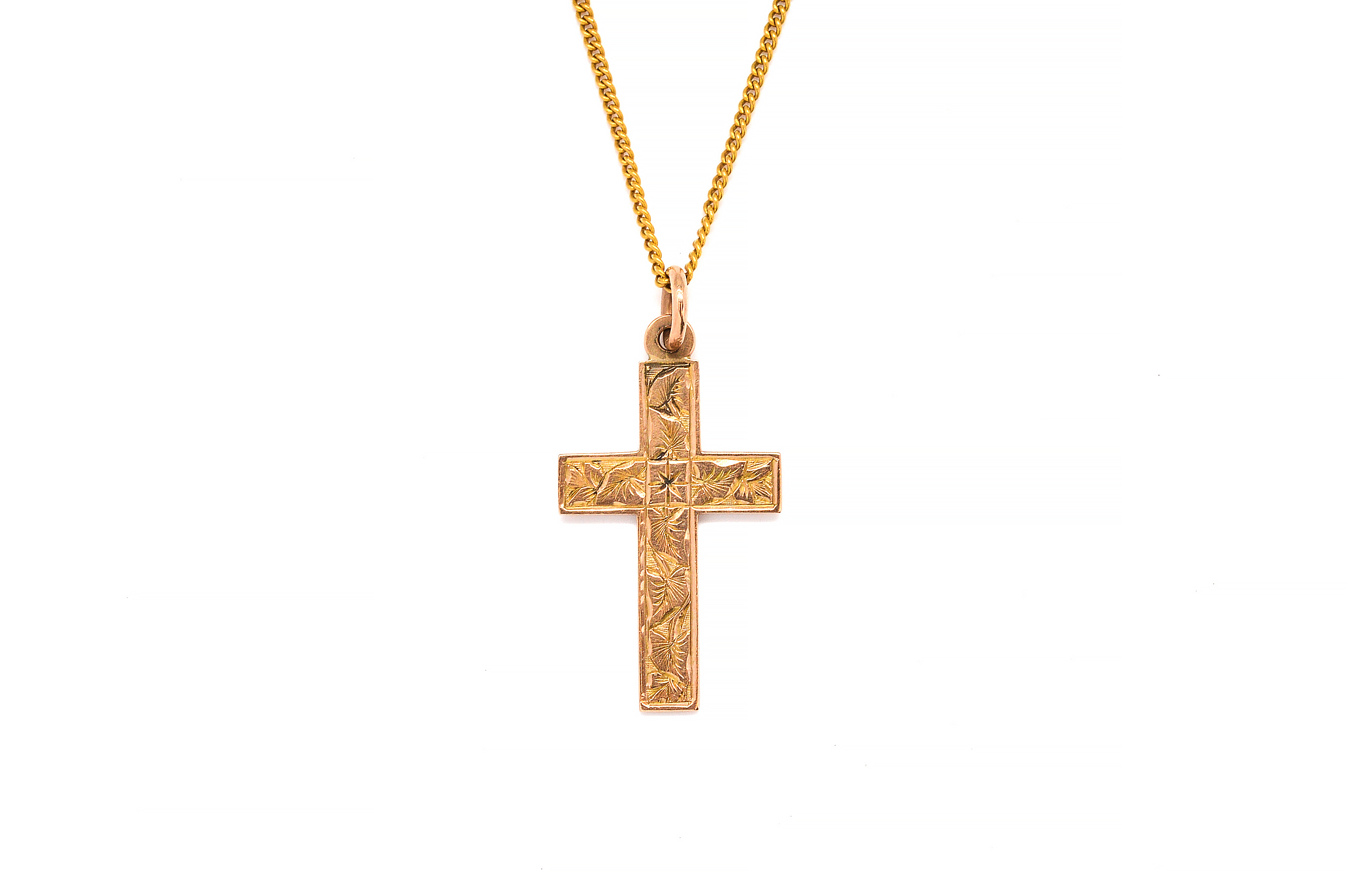 A 9CT GOLD PENDANT CROSS WITH A