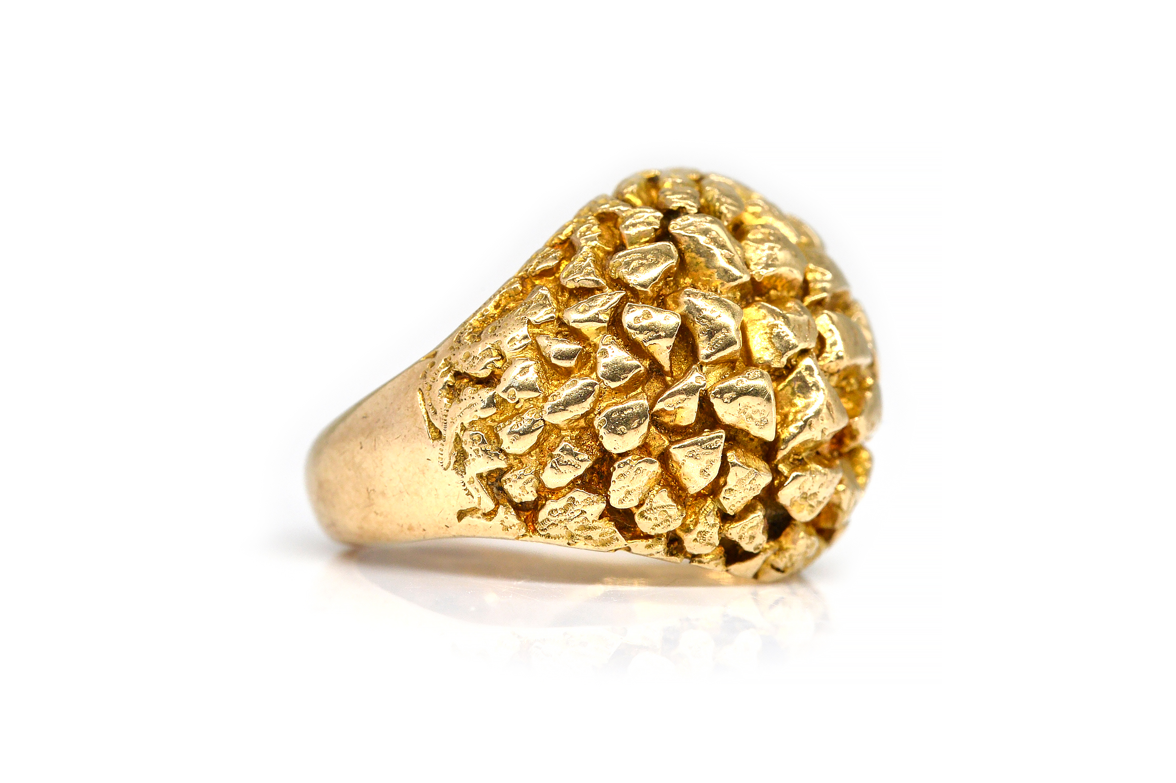 A 9CT GOLD RING In a cast bombe