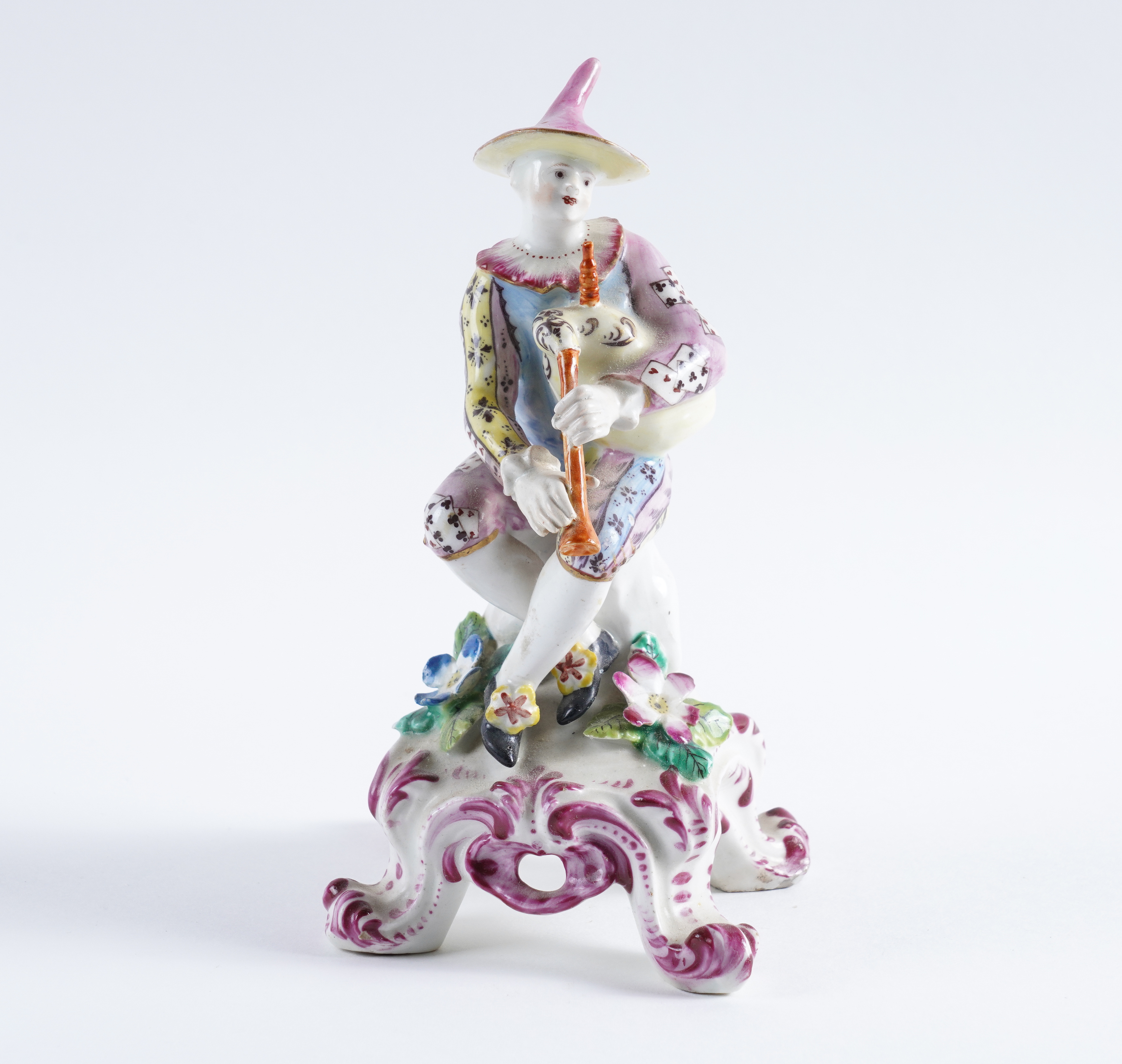A BOW FIGURE OF HARLEQUIN Circa