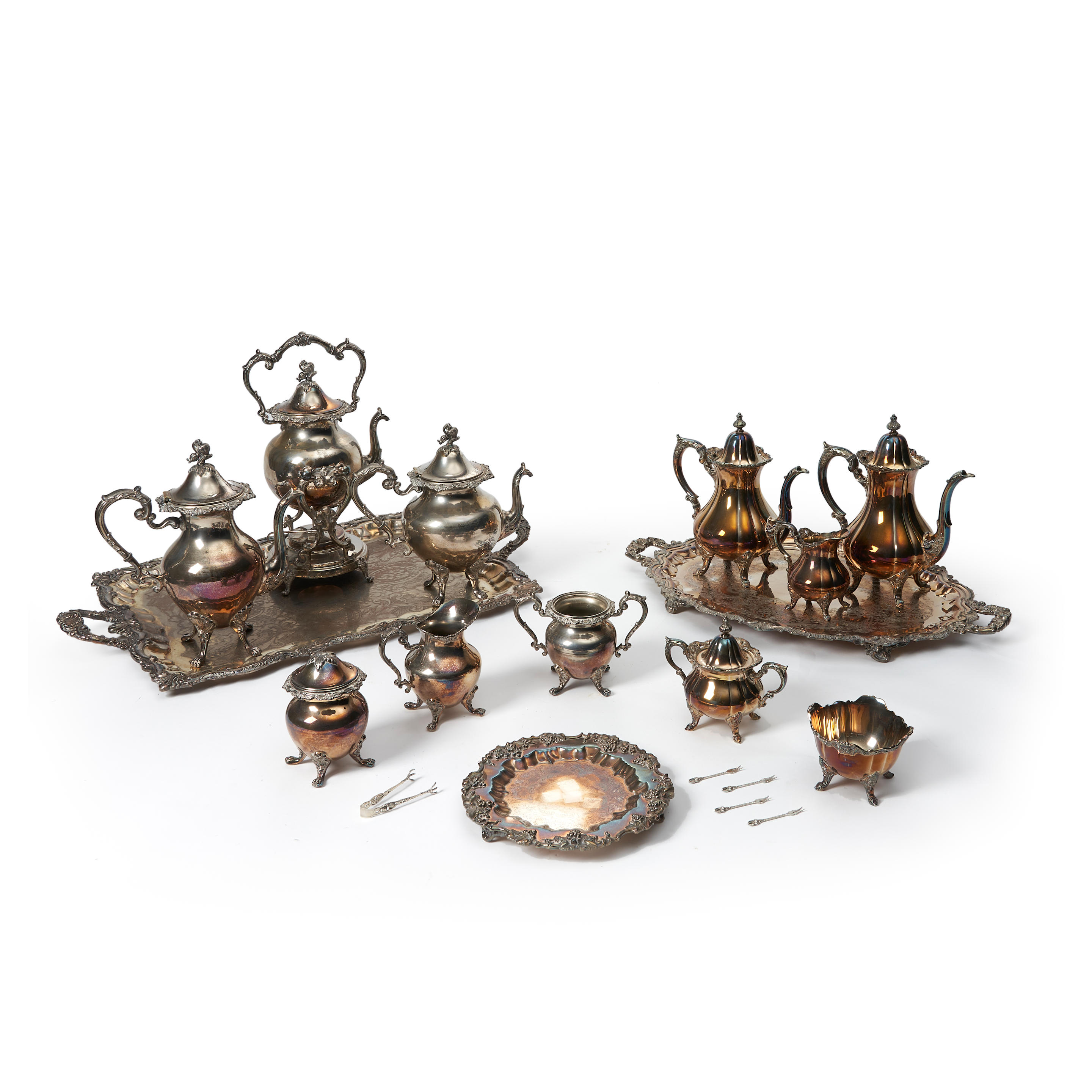 TWO SILVER-PLATED TEA SERVICES with