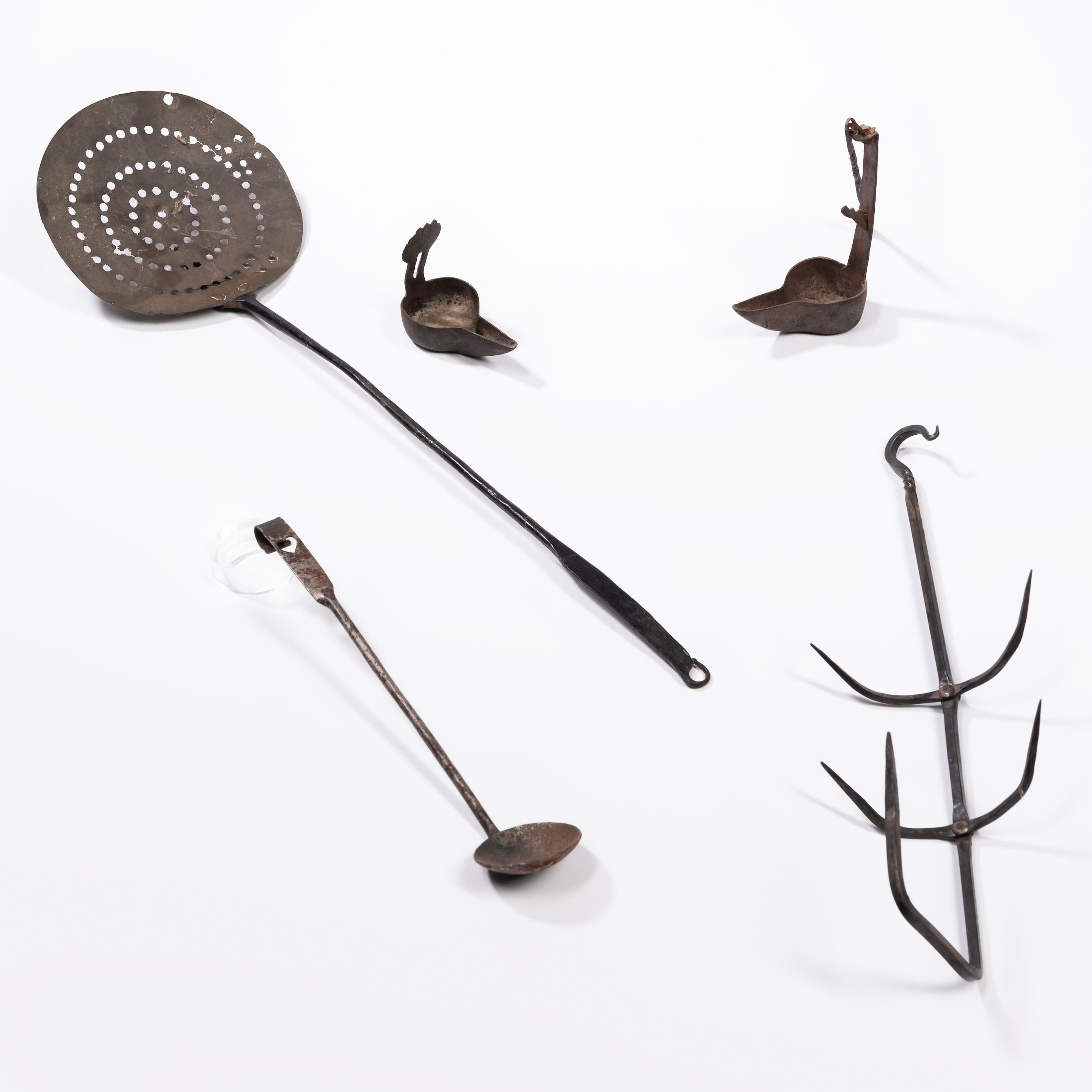 FIVE WROUGHT IRON IMPLEMENTS including