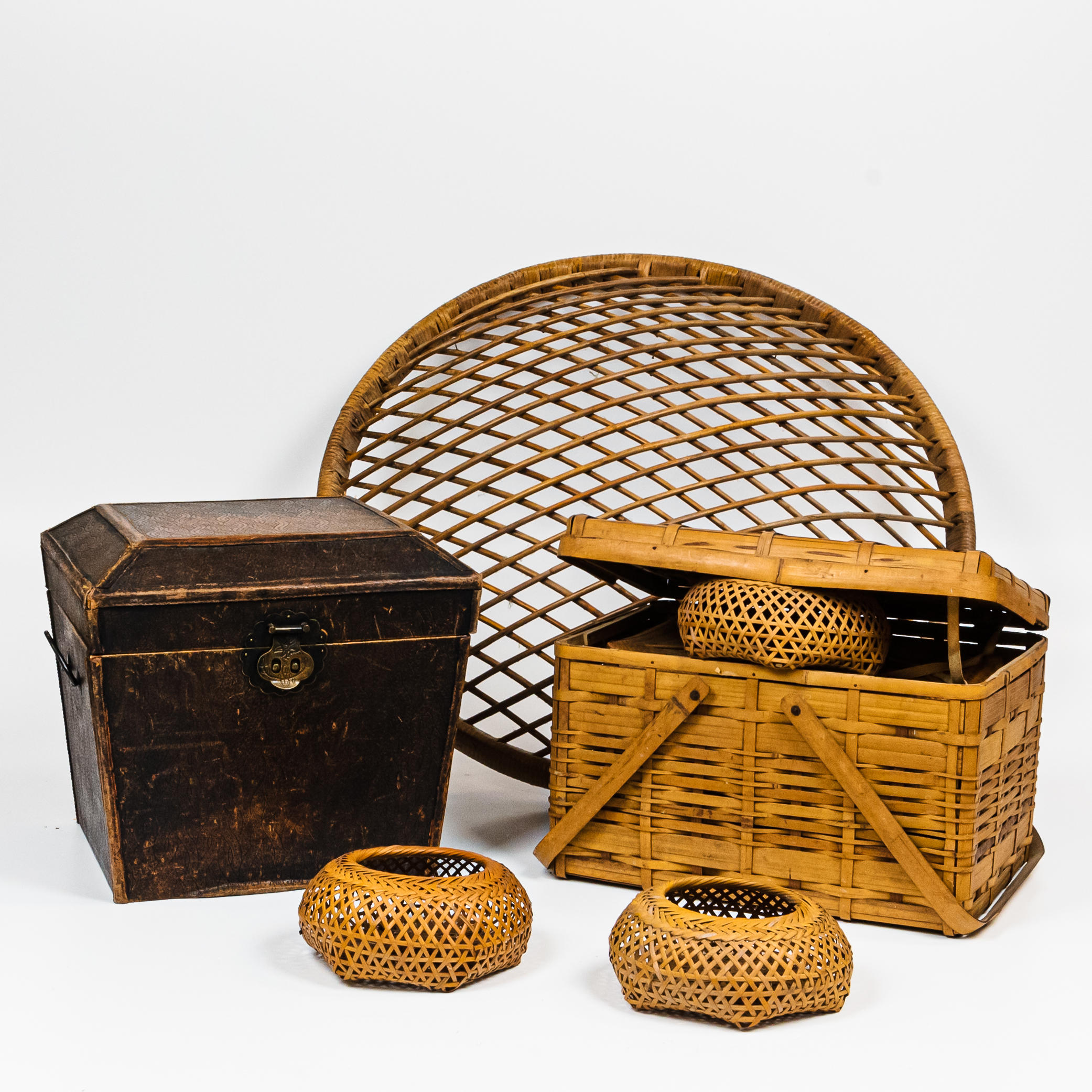 GROUP OF BASKETS AND A SMALL LEATHER