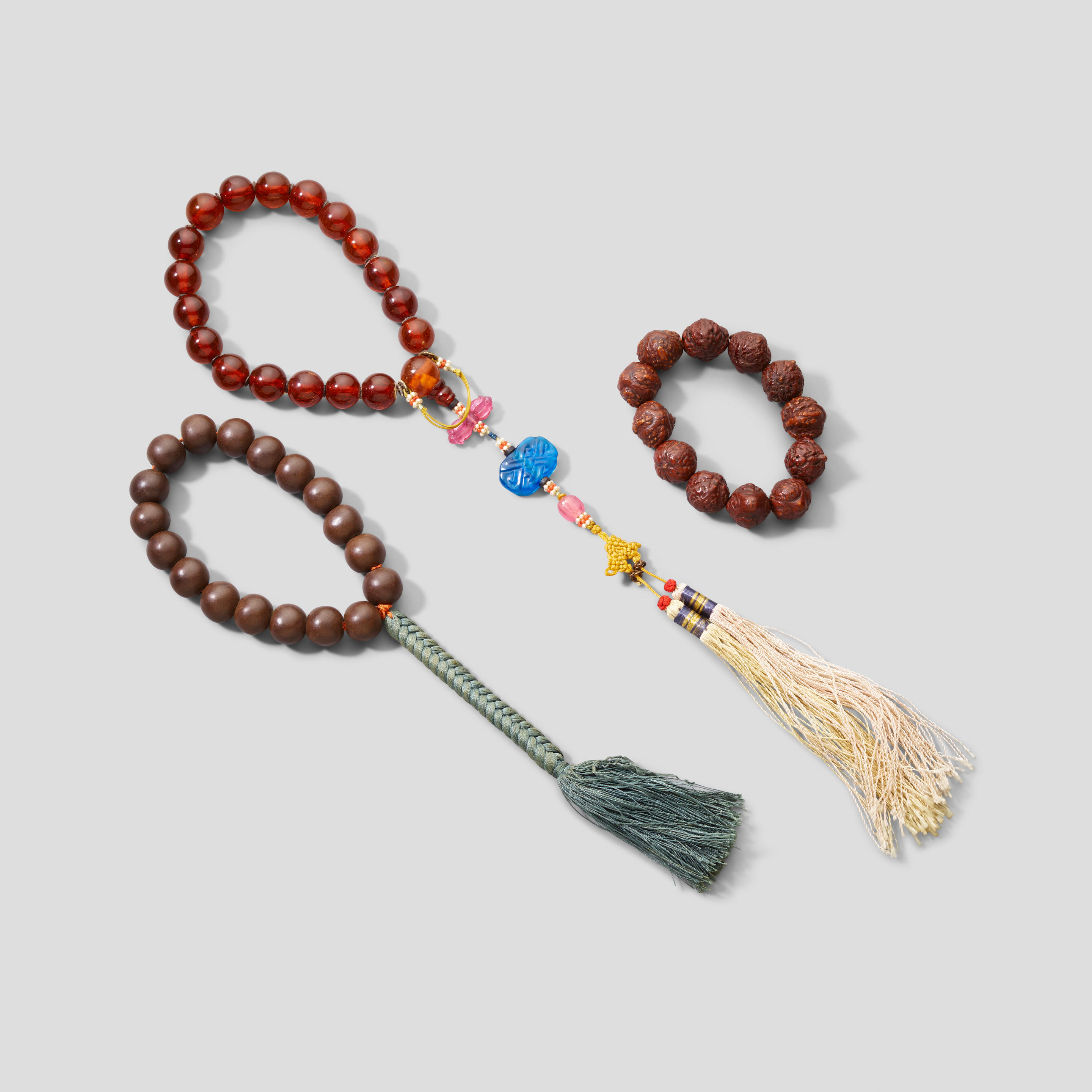 A GROUP OF THREE ASSEMBLED ROSARIES,