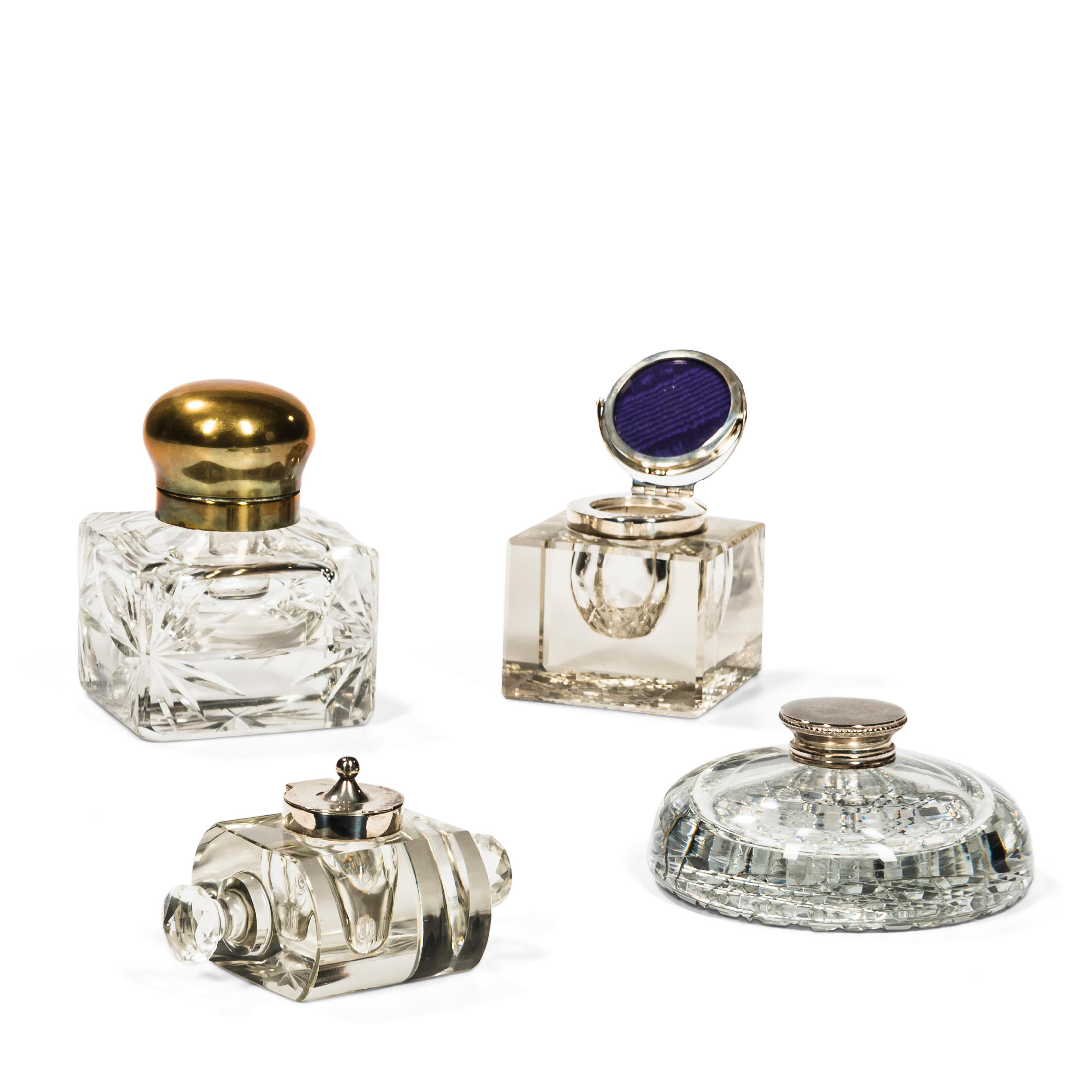 FOUR COLORLESS GLASS INKWELLS One