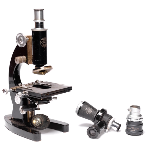 A Baker compound microscope, several