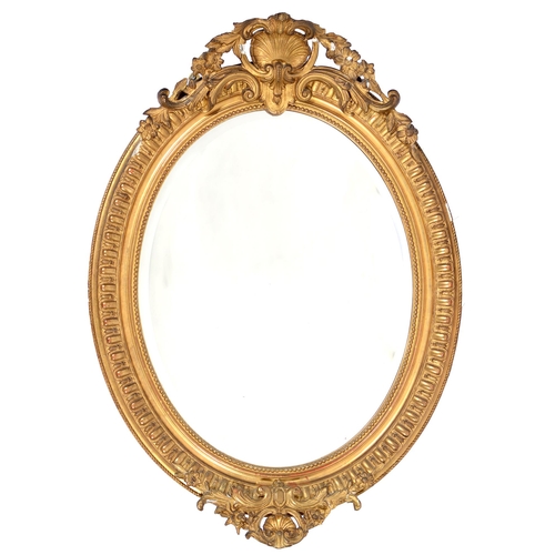 A Victorian oval giltwood and composition