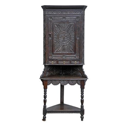 A Victorian carved oak corner cupboard 3af3ec