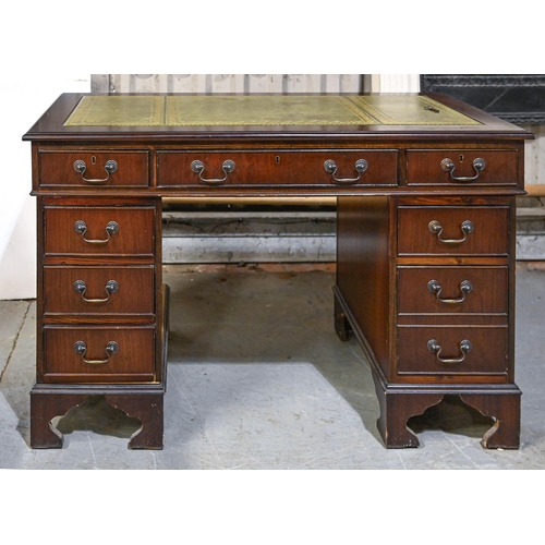 A mahogany pedestal desk, with tooled
