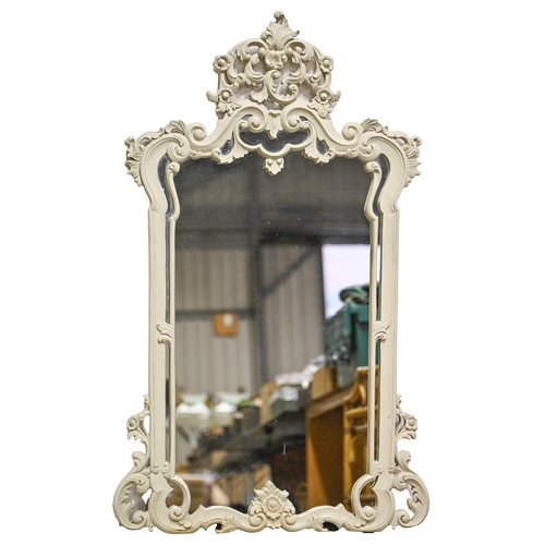 A carved and painted wood mirror,