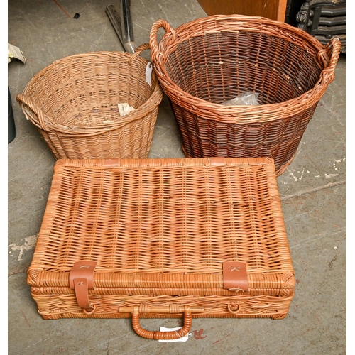 A wicker picnic basket and two