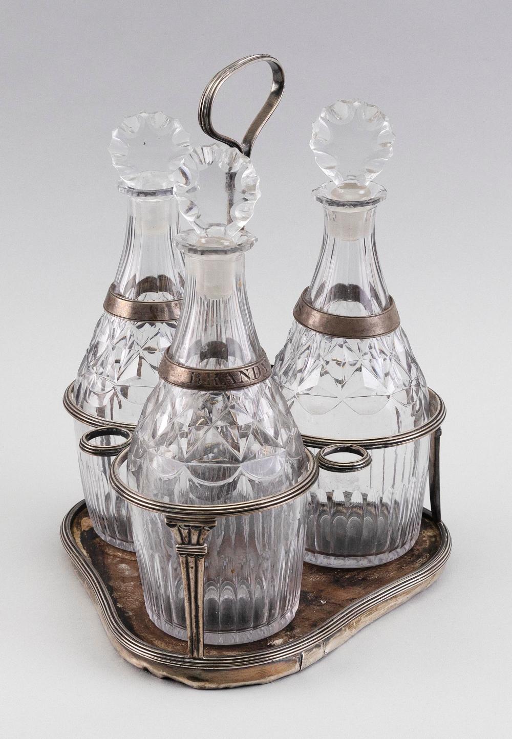 GEORGE III DECANTER SET ON STERLING