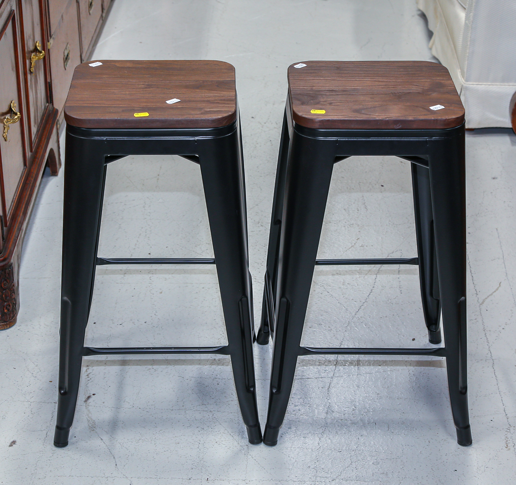 A PAIR OF IRON STOOLS Modern; the
