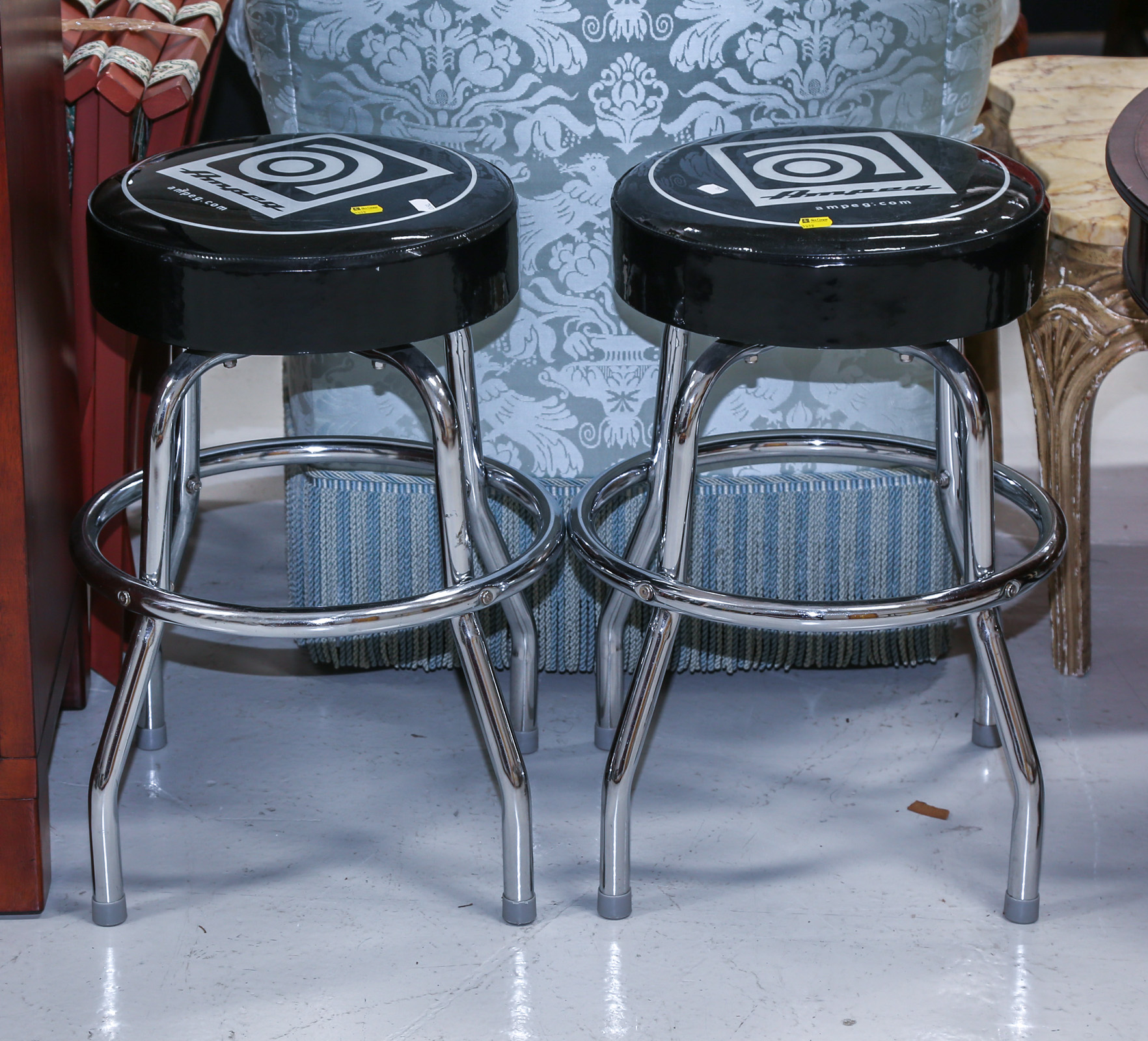 A PAIR OF REVOLVING STOOLS WITH CHROME