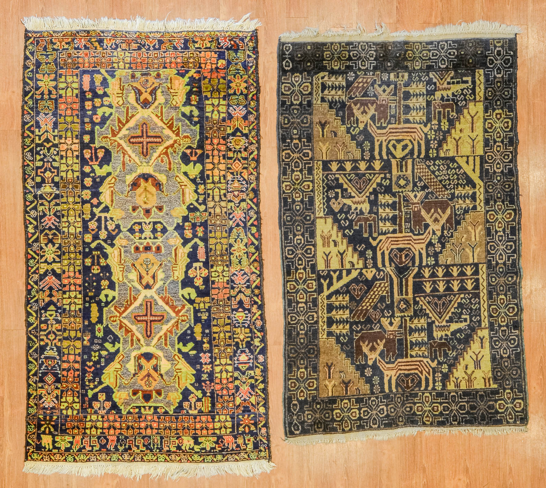 A PAIR OF TRIBAL DESIGN RUGS 3 9 3b256b