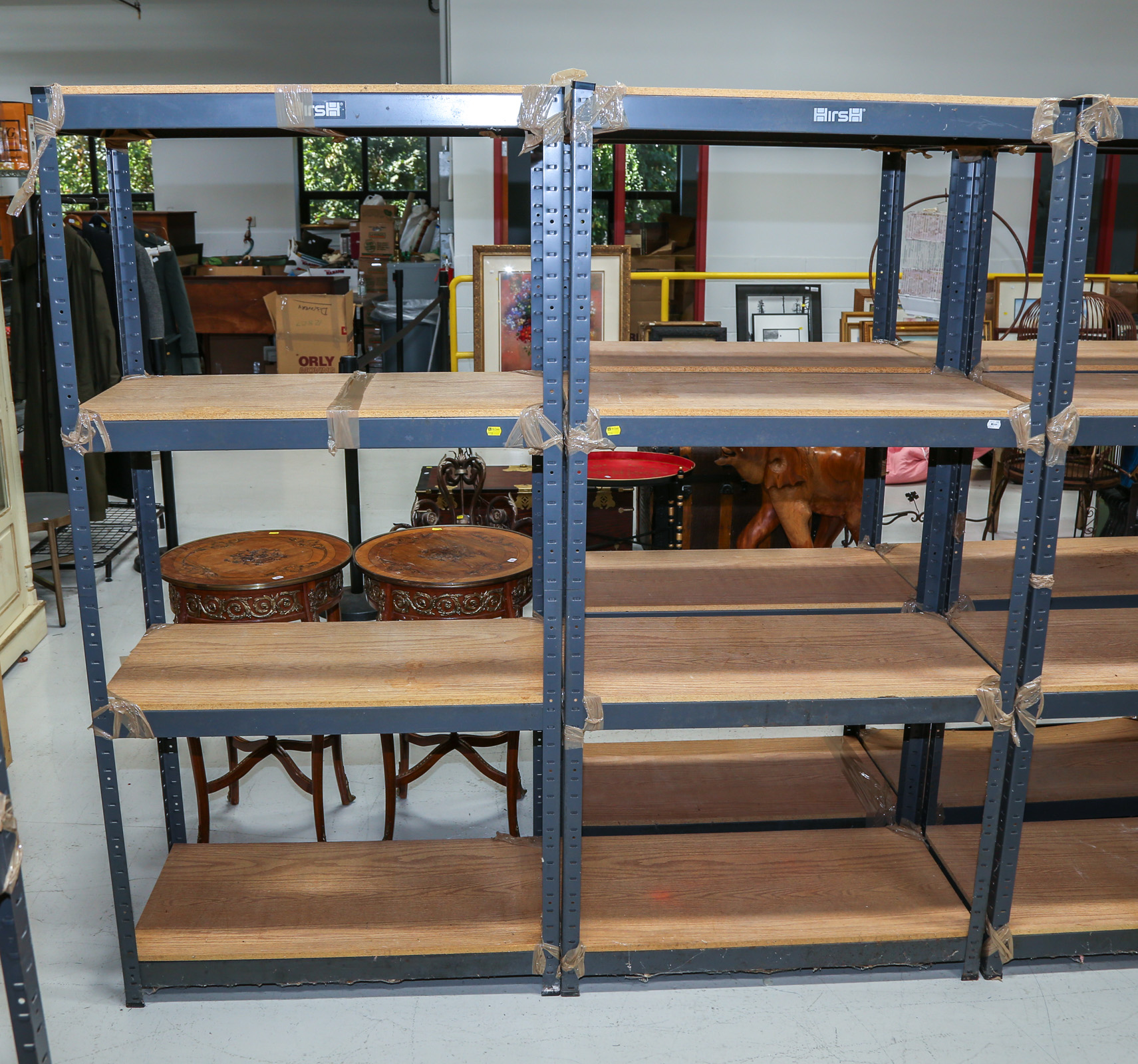 A PAIR OF METAL STORAGE RACKS With particle