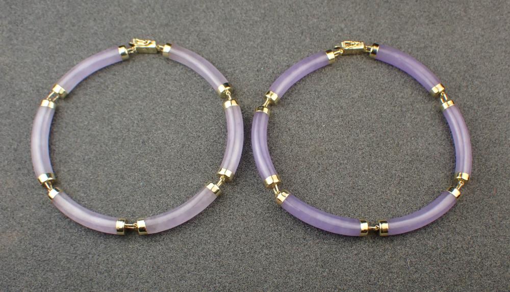 TWO LAVENDER JADE AND GOLD BRACELETSTWO