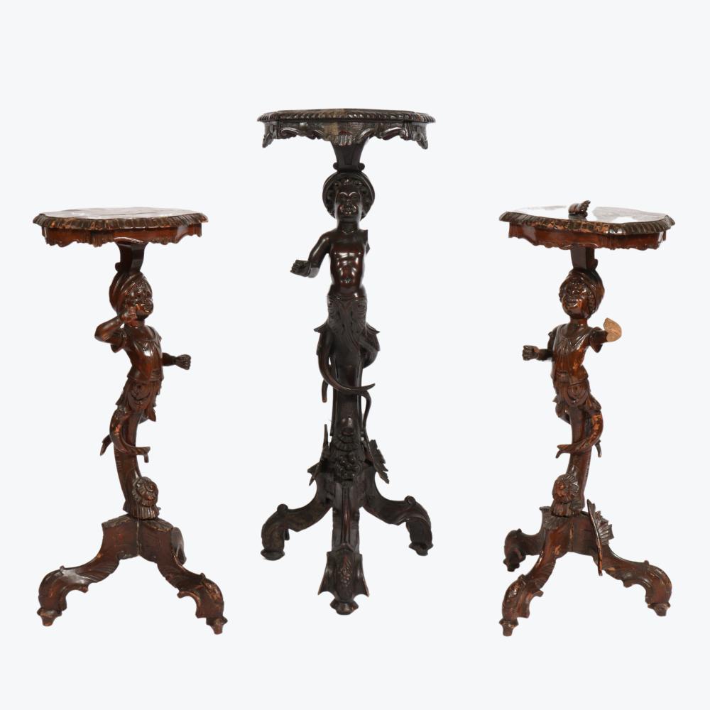 THREE ITALIAN CARVED FIGURAL TORCHIERE