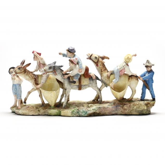 CAST PORCELAIN GROUP OF BOYS AND DONKEYS