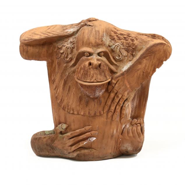 A LARGE TERRACOTTA GORILLA SCULPTURE