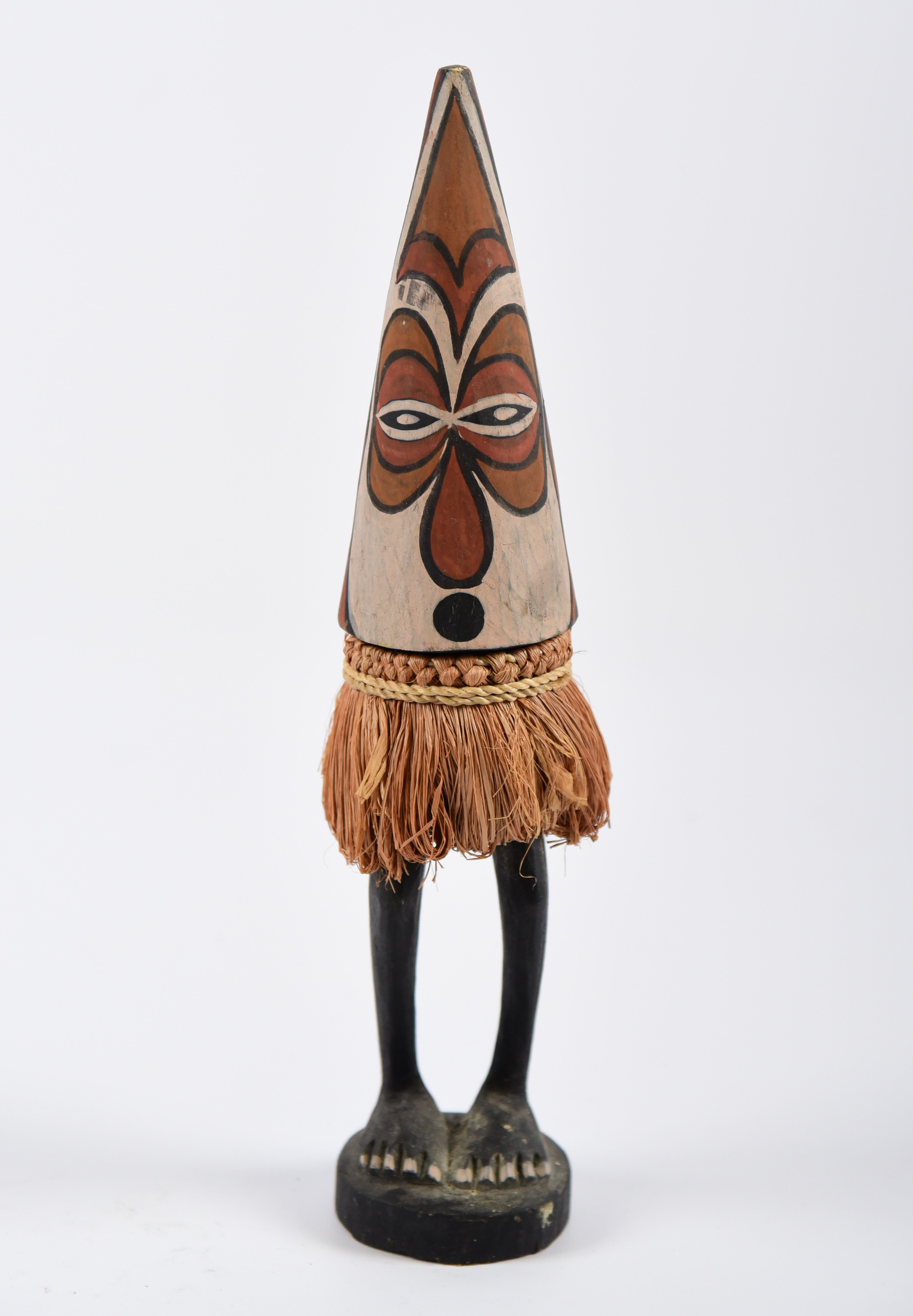 A carved and painted PNG spirit figure,