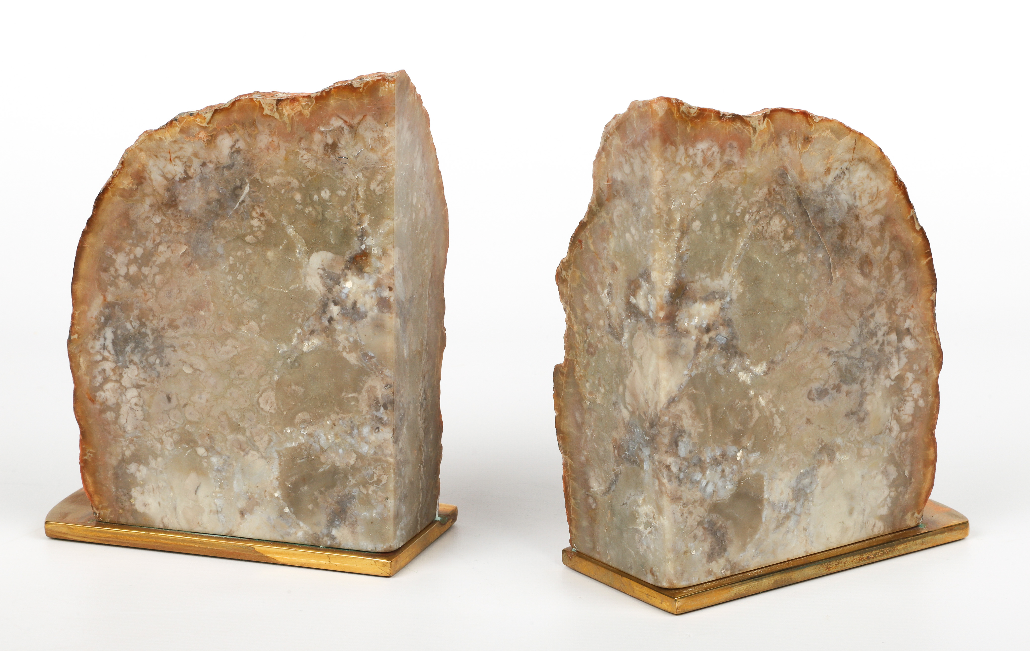 Polished agate bookends on brass,