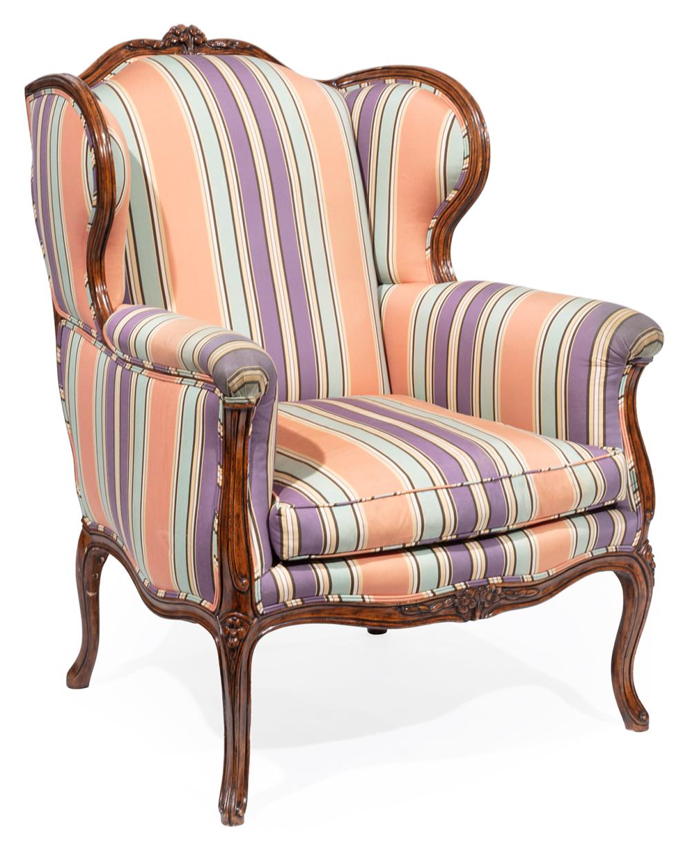 LOUIS XV-STYLE CARVED WALNUT WINGCHAIRLouis