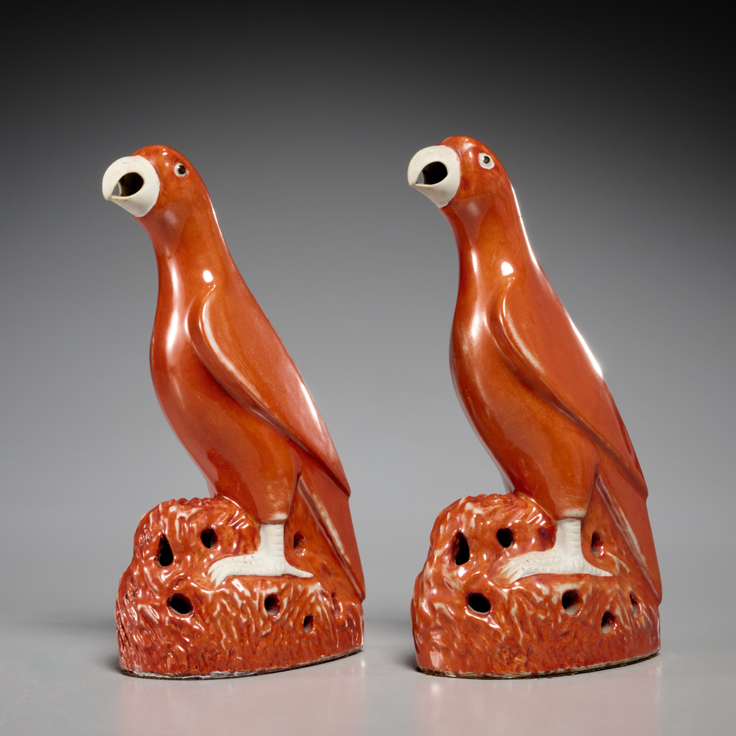 PAIR CHINESE RED GLAZED PARROTS
