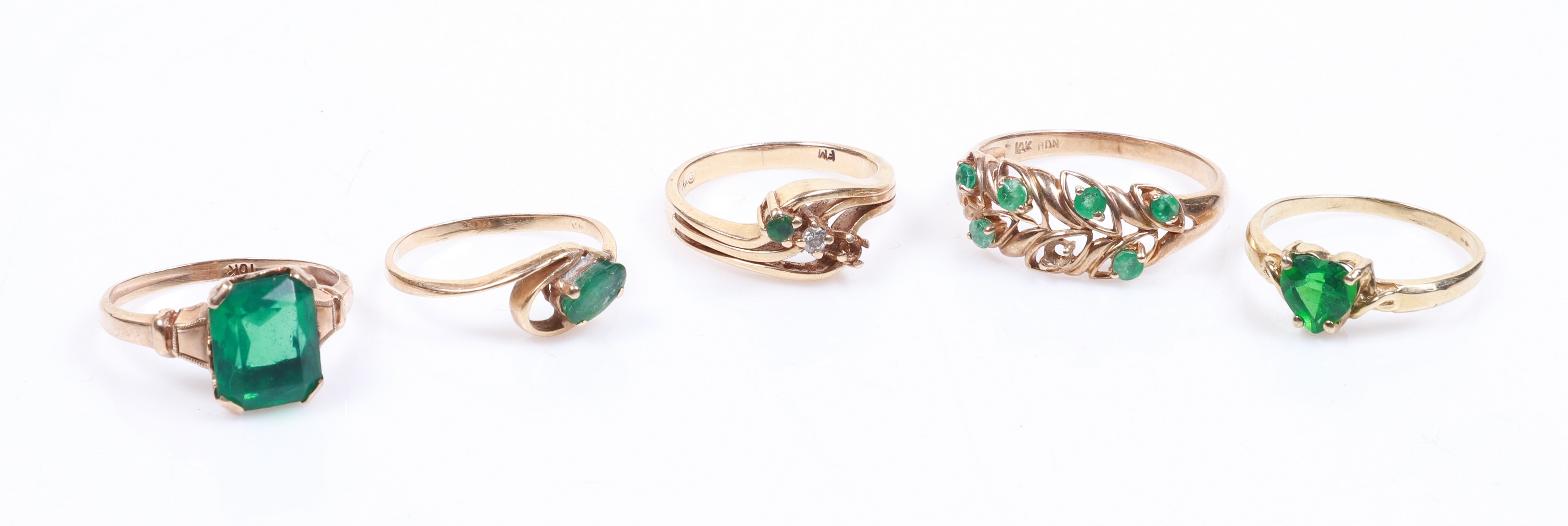 (5) Green centered gold rings to