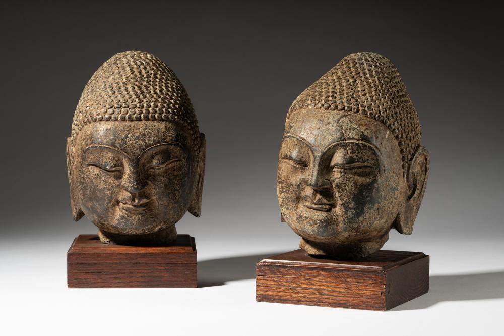 PAIR OF CHINESE HEADS OF BUDDHAPair