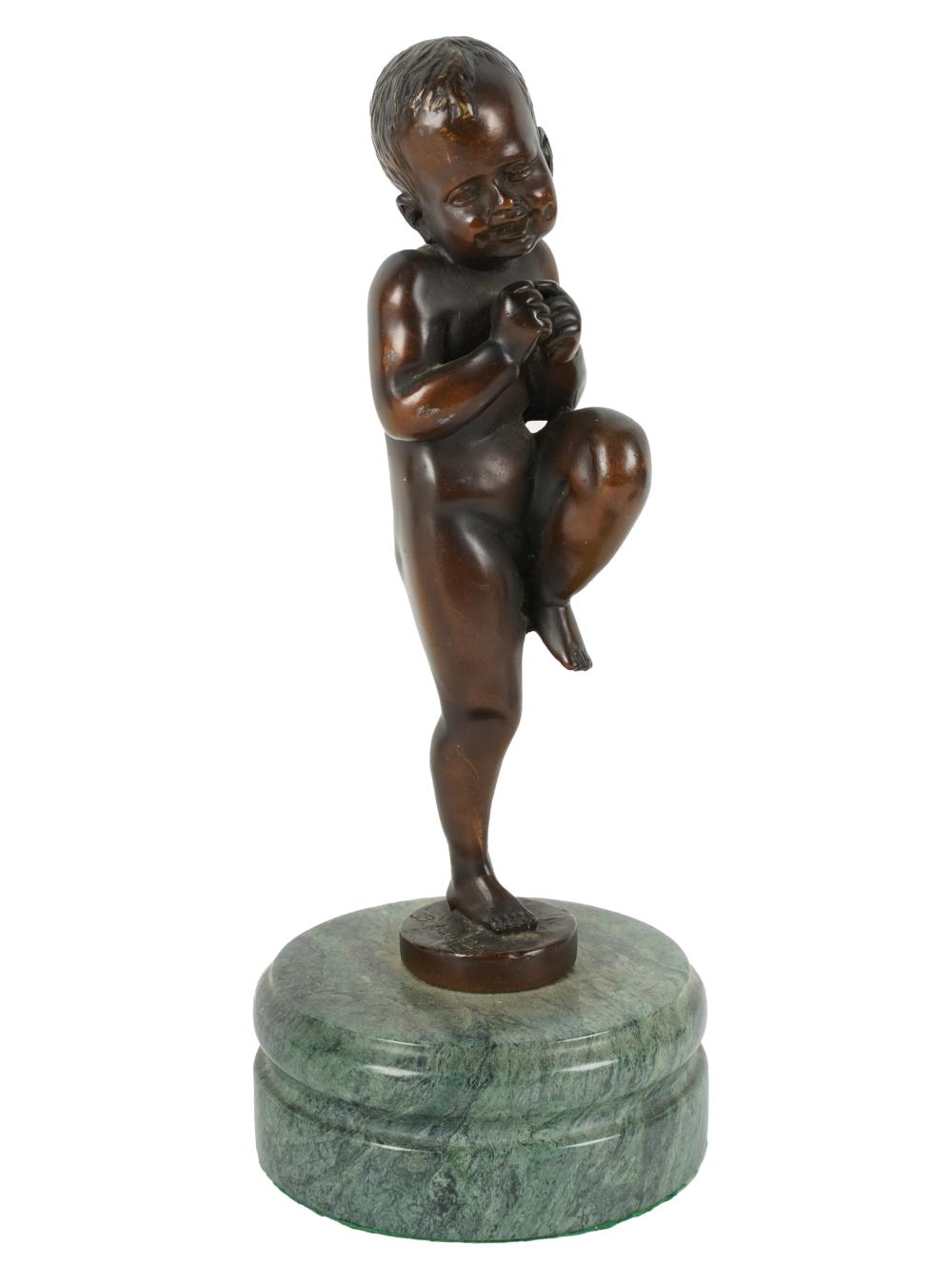 PATINATED BRONZE FIGURE OF A BOYPatinated