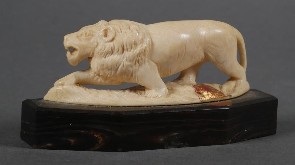 CARVED IVORY LION FIGURECarved figure