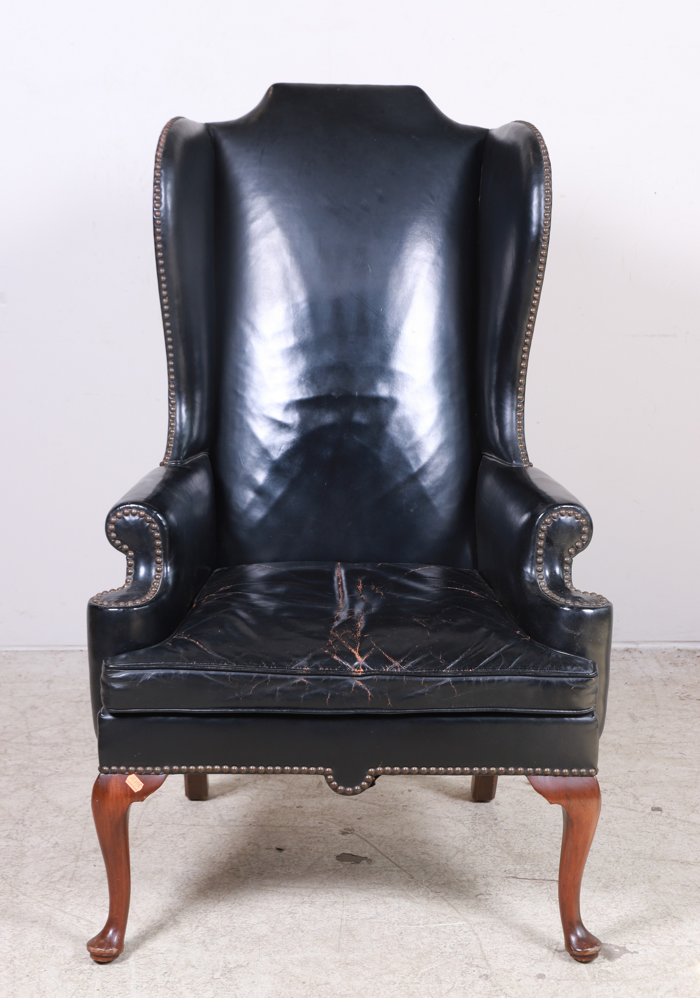 Queen Anne style leather wing chair  3b5a20