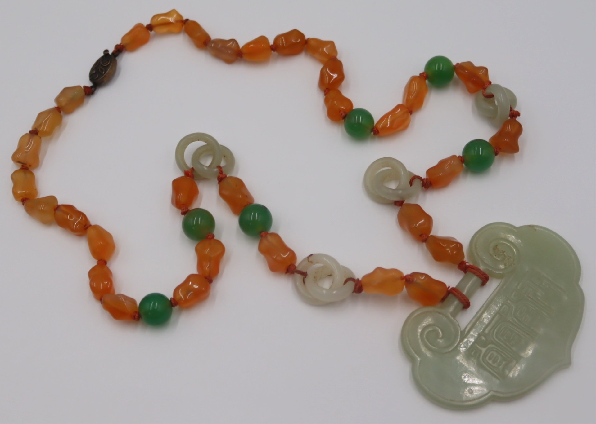 JEWELRY. CHINESE CARVED JADE &
