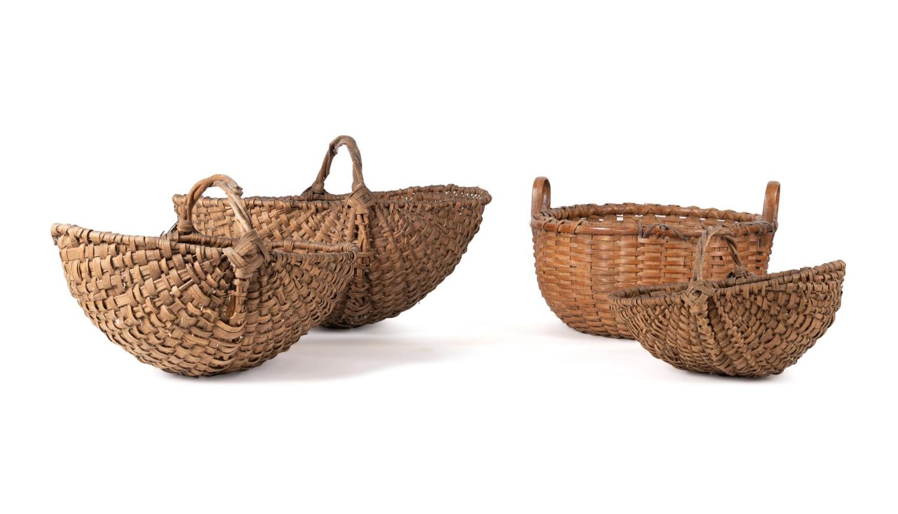 FOUR EARLY HANDWOVEN BASKETS Four