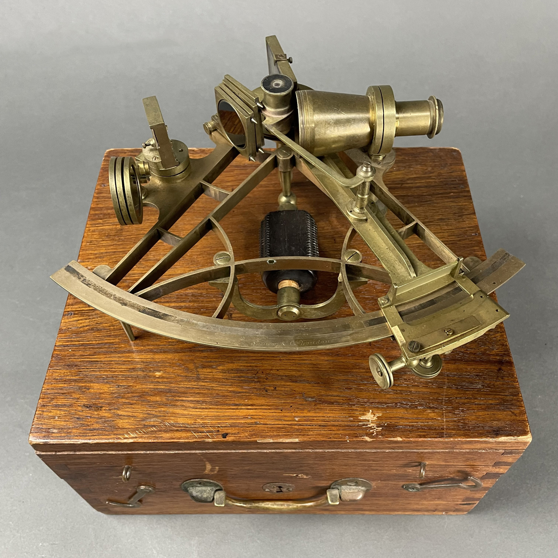 AN ENGLISH BRASS SEXTANT IN OAK CASE