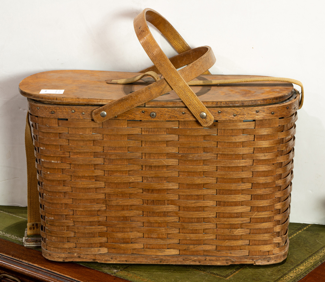 A VINTAGE WICKER PICNIC BASKET FITTED