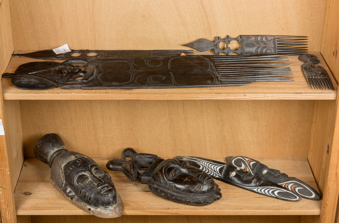 A GROUP OF AFRICAN COMBS AND MASKS 3b4289