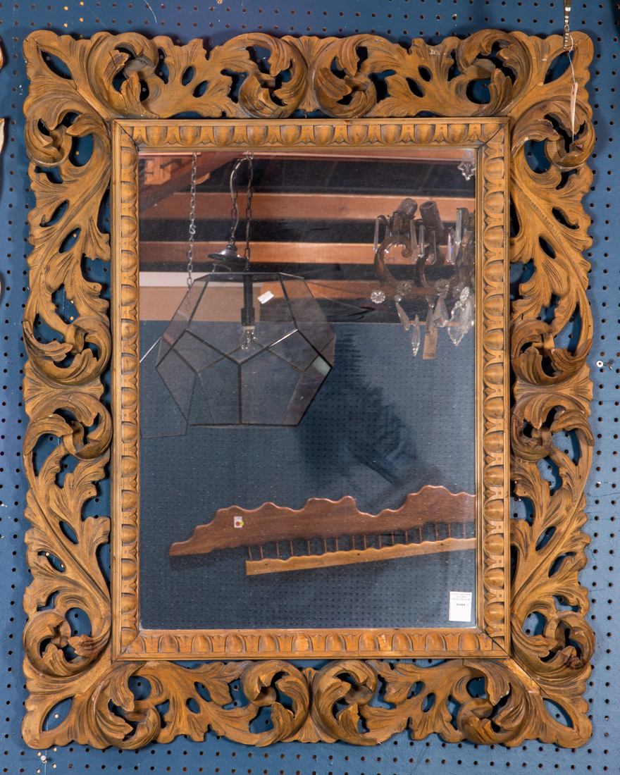 A BAROQUE STYLE PIERCE CARVED WOOD MIRROR