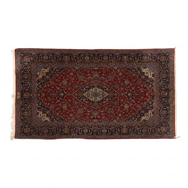 KASHAN AREA RUG The red field with