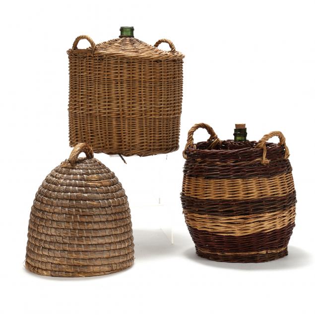 TWO LARGE BASKET COVERED DEMIJOHNS 3b6b87