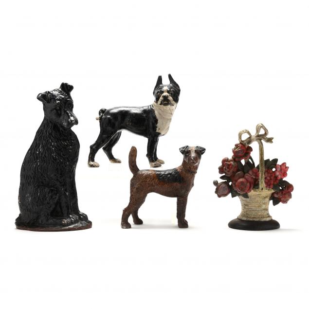 FOUR VINTAGE CAST IRON DOORSTOPS, INCLUDING