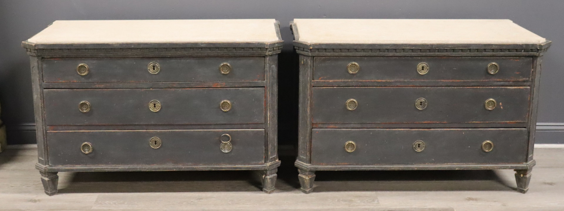 A PAIR OF STONE TOP ANTIQUE CHESTS.