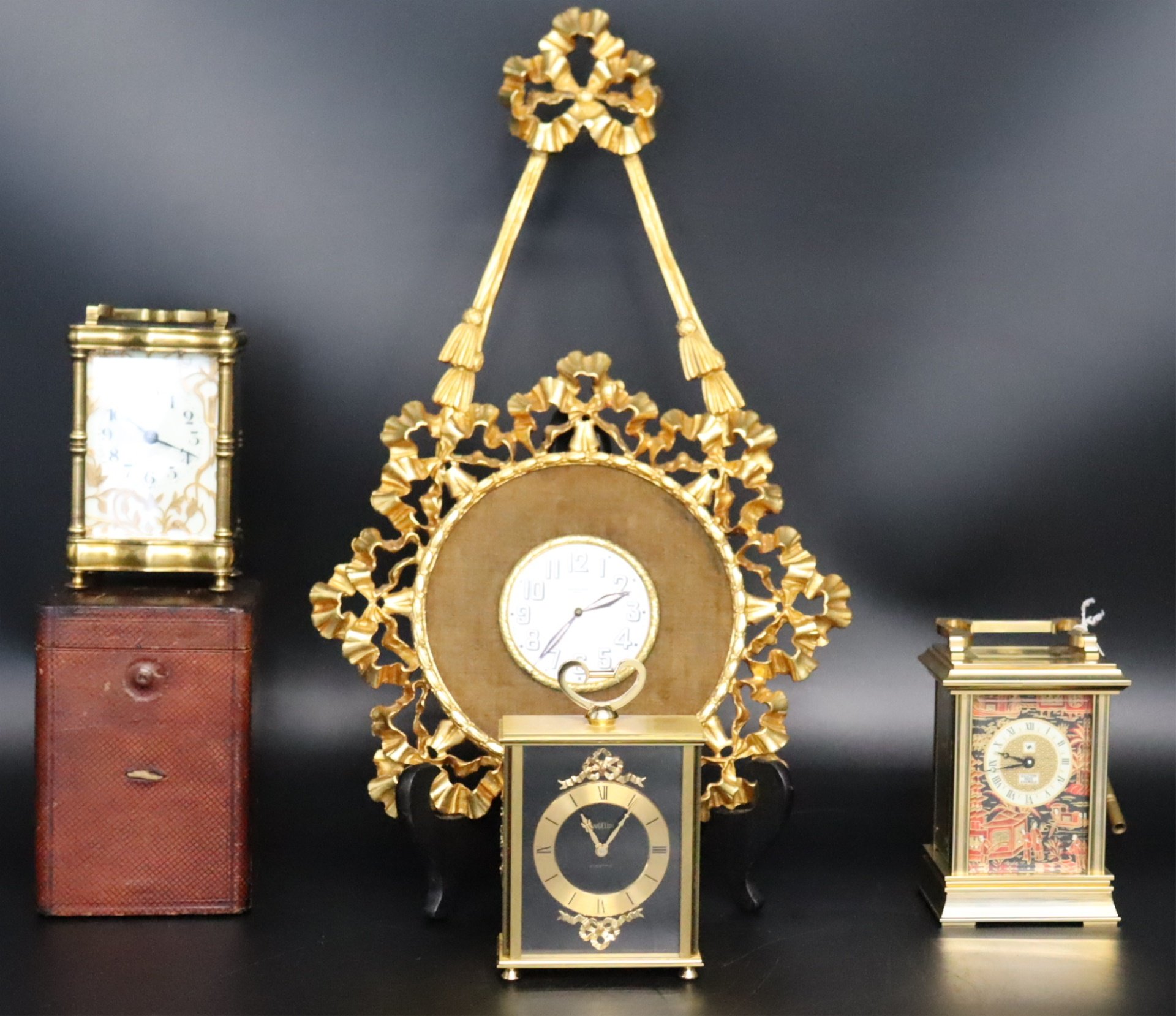 A GROUP OF 4 DECORATIVE CLOCKS