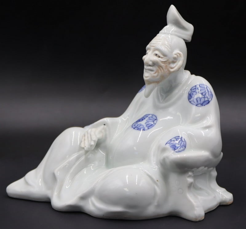 JAPANESE BLUE AND WHITE ROBED FIGURE