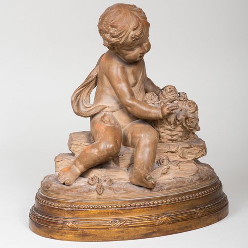 FRENCH TERRACOTTA PUTTI WITH A